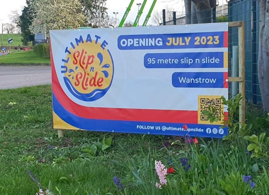 Ultimate Slip n Slide brand design on roadside banner