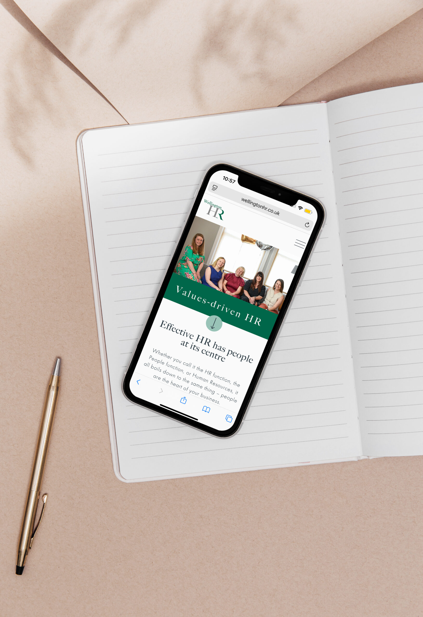Wellington HR Website Design displayed on a mobile phone