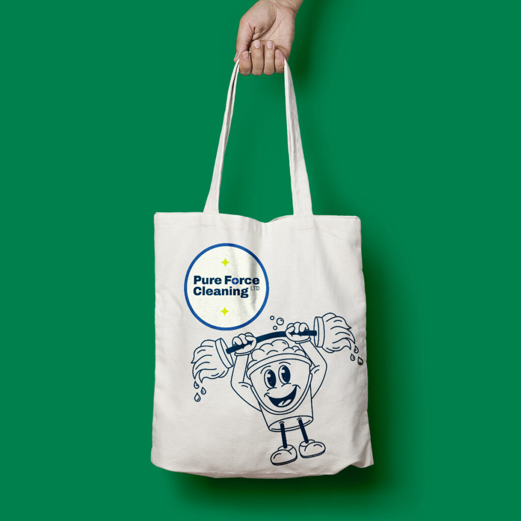 A mockup of Pure Force Cleaning tote bag design with their Brand Design